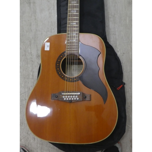 42 - An EKO twelve string accoustic guitar with a soft fabric carrying case 