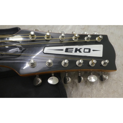 42 - An EKO twelve string accoustic guitar with a soft fabric carrying case 