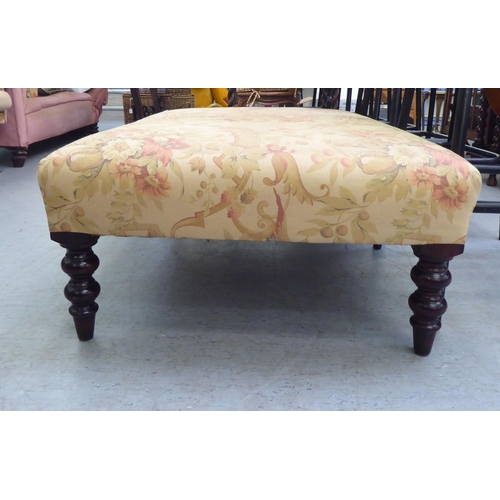 51 - A modern George Smith of Newcastle fabric upholstered footstool, raised on turned legs 