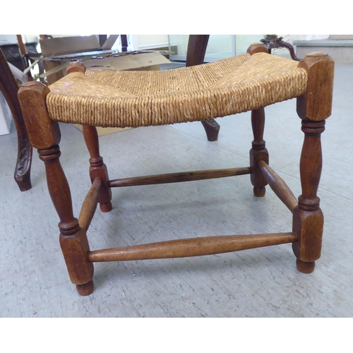 52 - Small furniture: to include an early 20thC carved oak spinning chair 