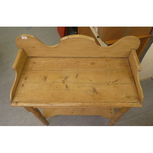 57 - An early 20thC rustic pine washstand, raised on turned legs, united by a platform undershelf  3... 