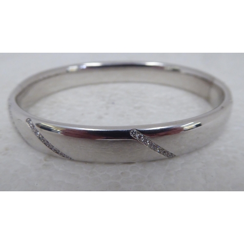104 - An 18ct white gold and diamonds set bangle&nbsp;