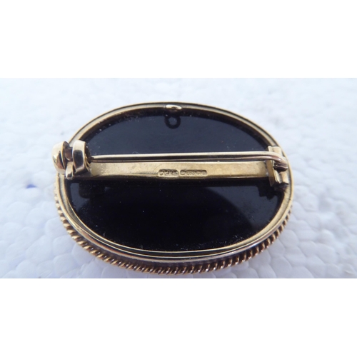 109 - A 9ct gold framed cameo, depicting a galloping horse&nbsp;