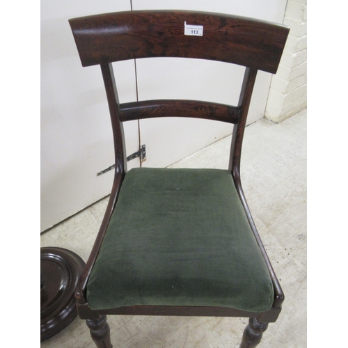 113 - A pair of Victorian mahogany framed round bar crest dining chairs, the upholstered seats raised on t... 