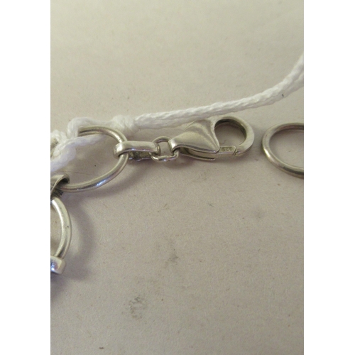 60 - A silver coloured metal multi-gem set necklace, on a dog-clip clasp
