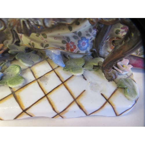 65 - Late 19th/early 20thC Bavarian porcelain figures, viz. a girl wearing a floral dress and bonnet, hol... 