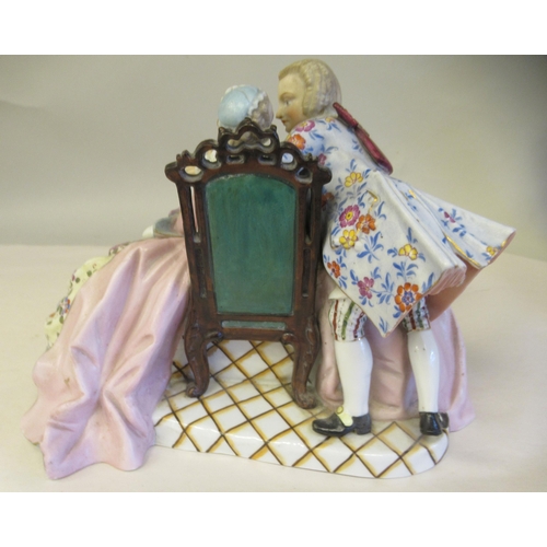 65 - Late 19th/early 20thC Bavarian porcelain figures, viz. a girl wearing a floral dress and bonnet, hol... 