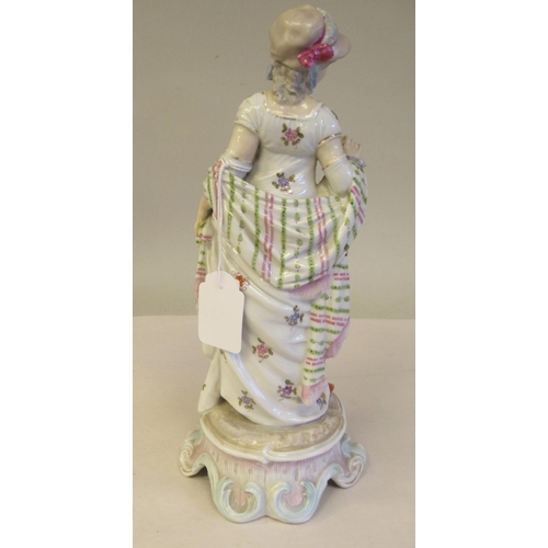 65 - Late 19th/early 20thC Bavarian porcelain figures, viz. a girl wearing a floral dress and bonnet, hol... 