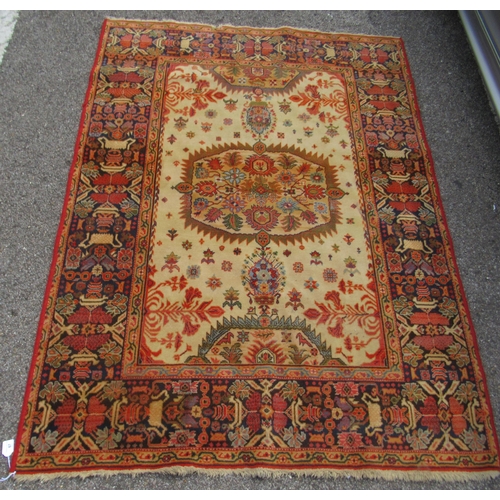 67 - A Persian Bachtia design rug, on a burnt orange and multi-coloured ground&nbsp; 54