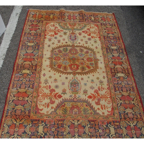 67 - A Persian Bachtia design rug, on a burnt orange and multi-coloured ground&nbsp; 54