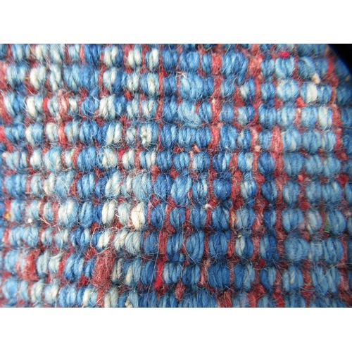 70 - A Gabbeh Shiraz woollen carpet, decorated in bright colours, on a pale ground, bordered by box desig... 