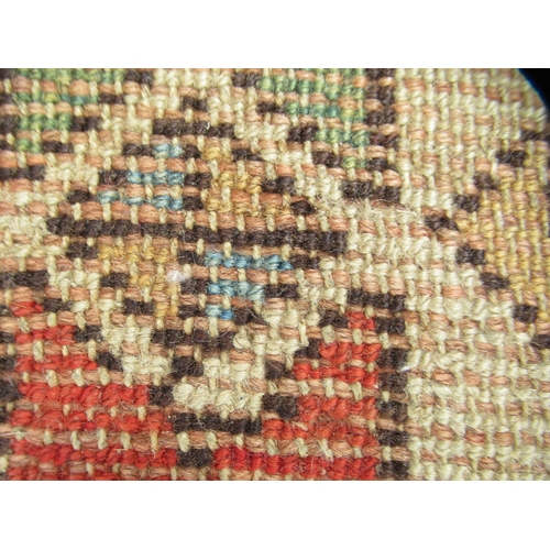 75 - A North African design rug, decorated with repeating star and other designs, on a multi-coloured gro... 