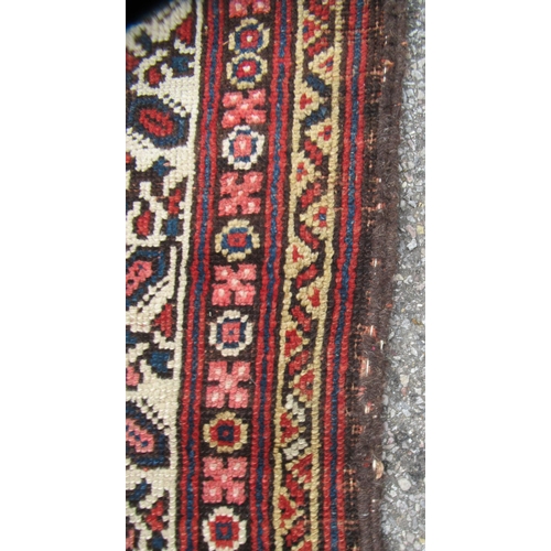 78 - A Persian runner, decorated with a central panel, bordered by zig-zag and foliate designs, on a main... 