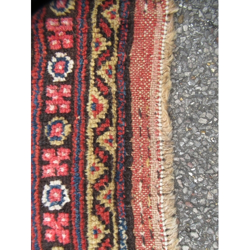 78 - A Persian runner, decorated with a central panel, bordered by zig-zag and foliate designs, on a main... 