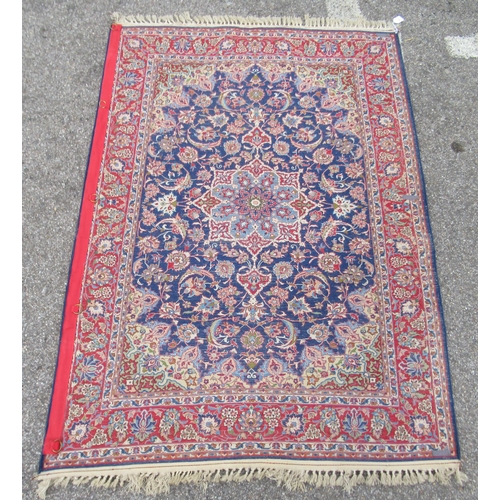 81 - A Persian part silk rug, decorated with a central motif and bordered by floral and foliate designs, ... 