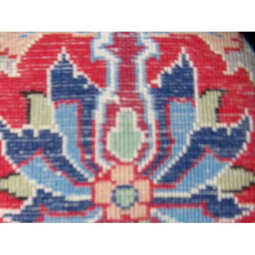 81 - A Persian part silk rug, decorated with a central motif and bordered by floral and foliate designs, ... 