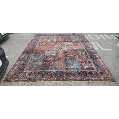 84 - A Turkish Ushack carpet, decorated with four quarters of six box design panels, on a multi-coloured ... 