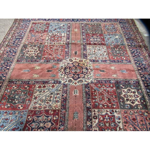 84 - A Turkish Ushack carpet, decorated with four quarters of six box design panels, on a multi-coloured ... 