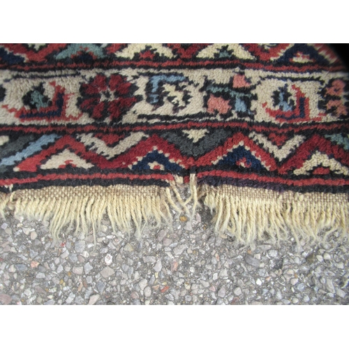 84 - A Turkish Ushack carpet, decorated with four quarters of six box design panels, on a multi-coloured ... 
