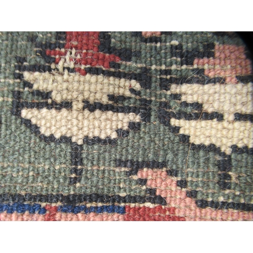 84 - A Turkish Ushack carpet, decorated with four quarters of six box design panels, on a multi-coloured ... 