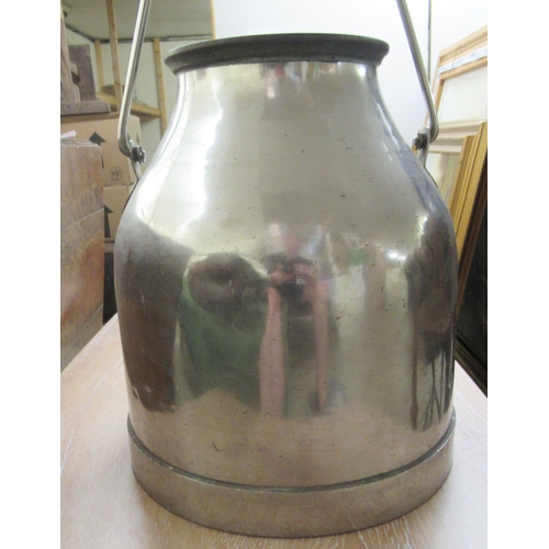 93 - A stainless steel churn with a wide lip and swing handle&nbsp; 15