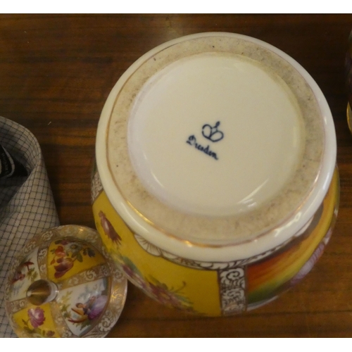 97 - A pair of Dresden porcelain vases and covers, each decorated with panels, depicting a courting coupl... 