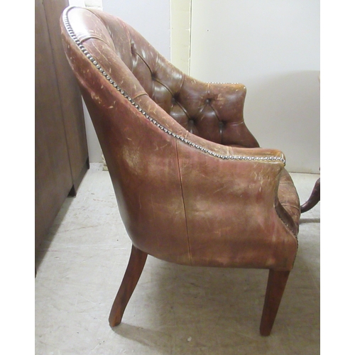 98 - An early 19thC style tub design study chair with a studded and buttoned, mid brown hide back and sea... 