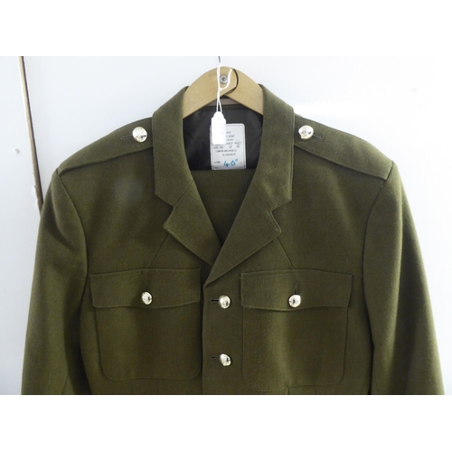 102 - Mainly vintage military uniforms and associated clothing: to include a coat(Please Note: this lot is... 