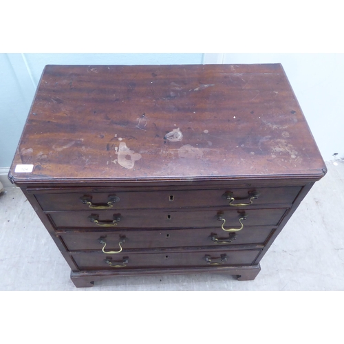 104 - A George III mahogany bachelor's chest, the top with re-entrant corners, over a brushing slide and f... 