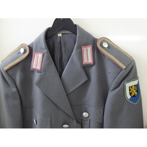 107 - Mainly vintage foreign military uniforms and associated clothing: to include tunics(Please Note: thi... 