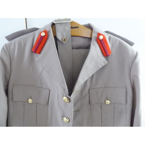 107 - Mainly vintage foreign military uniforms and associated clothing: to include tunics(Please Note: thi... 