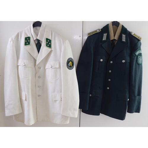 107 - Mainly vintage foreign military uniforms and associated clothing: to include tunics(Please Note: thi... 