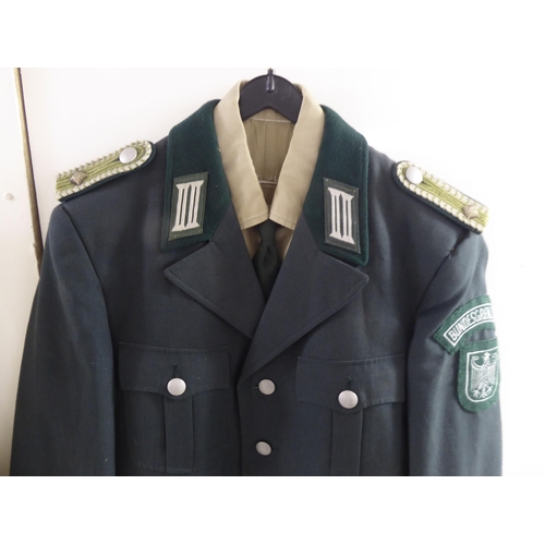 107 - Mainly vintage foreign military uniforms and associated clothing: to include tunics(Please Note: thi... 