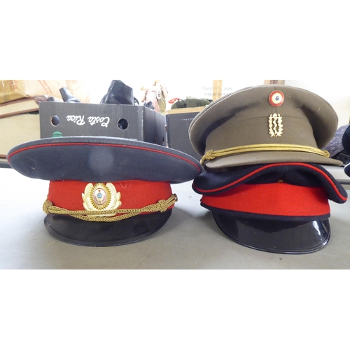 117 - Eight various foreign military and military style peaked caps(Please Note: this lot is subject to th... 