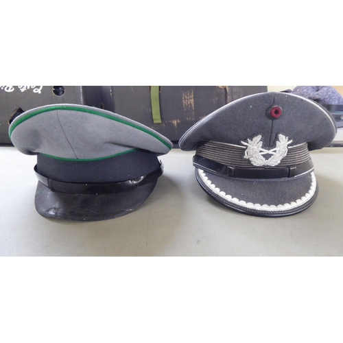 117 - Eight various foreign military and military style peaked caps(Please Note: this lot is subject to th... 