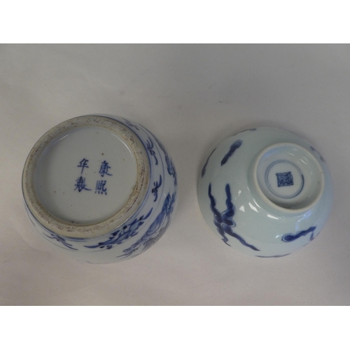 119 - Nine items of 20thC Chinese porcelain: to include a bowl, decorated in blue and white with a footed ... 