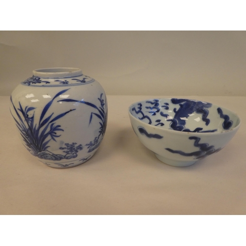 119 - Nine items of 20thC Chinese porcelain: to include a bowl, decorated in blue and white with a footed ... 