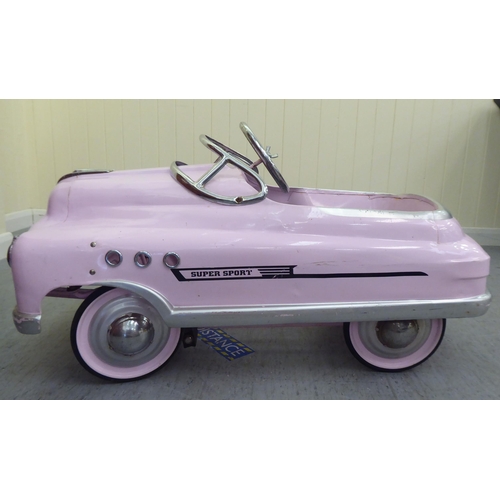 12 - A painted model pedal car, Super Sport in pale pink livery with rubber wheels  40