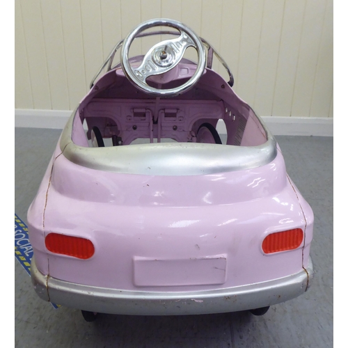 12 - A painted model pedal car, Super Sport in pale pink livery with rubber wheels  40