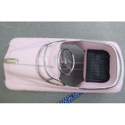 12 - A painted model pedal car, Super Sport in pale pink livery with rubber wheels  40