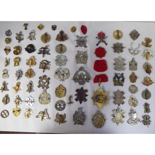 120 - Approx. fifty-five military cap badges and other insignia, some copies: to include Glider Pilot Regi... 