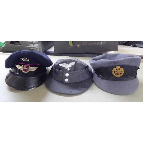 121 - Various German and other military related headgear: to include side caps and berets; and four simila... 