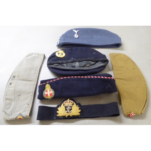 121 - Various German and other military related headgear: to include side caps and berets; and four simila... 