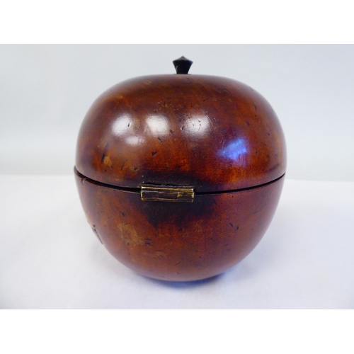 128 - A 19thC turned treen tea caddy in the form of an apple with a lockable, hinged lid  5.25