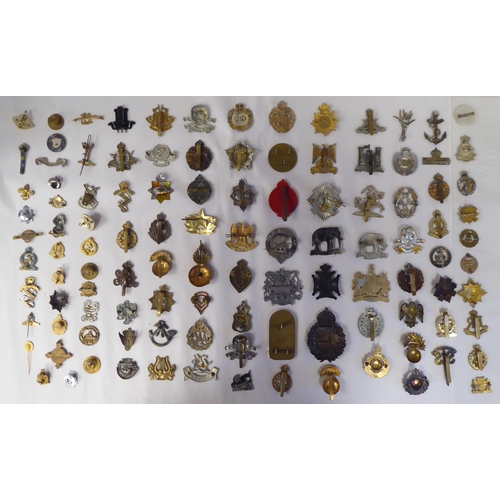 130 - Approx. fifty-five military cap badges and other insignia, some copies: to include 19th PWO Hussars;... 