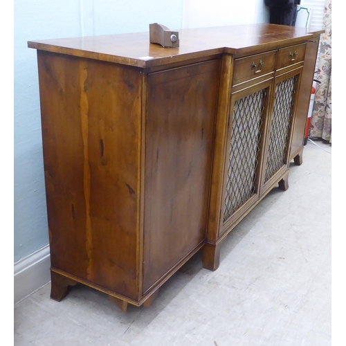 134 - A modern Regency style yewwood finished, breakfront sideboard with ebony string inlaid decoration, c... 