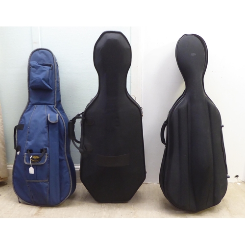 137 - A modern quarter size and a half size cello with fabric carrying cases; and another (empty) fitted c... 