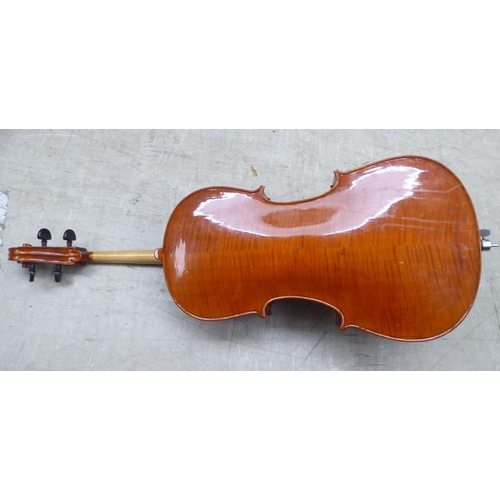 137 - A modern quarter size and a half size cello with fabric carrying cases; and another (empty) fitted c... 