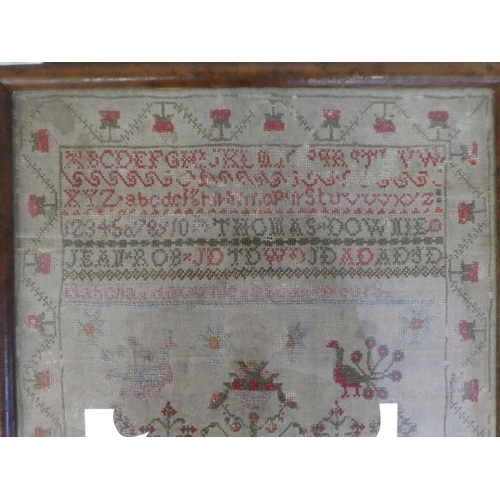 139 - A 19thC sampler worked in coloured wool, incorporating the alphabet and Arabic numerals, figures, bi... 