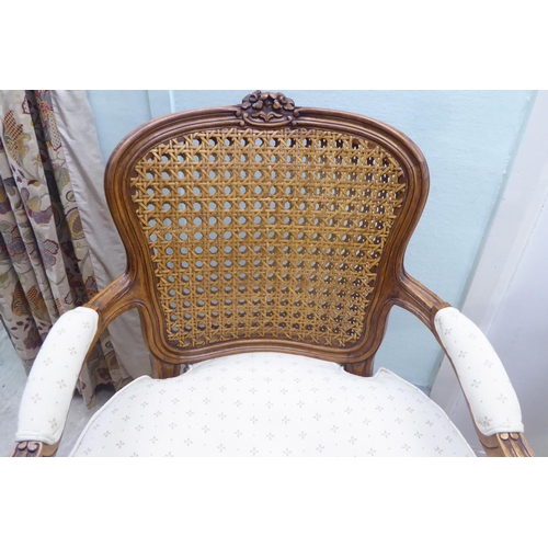 146 - A pair of modern French style, moulded and carved beech framed open arm chairs, each having a double... 